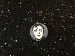 Get spooky with the Peter Lorre Zombie Pinback Button. Perfect for horror fans and zombie enthusiasts. Hand-crafted with love, it's a must-have creepy accessory.