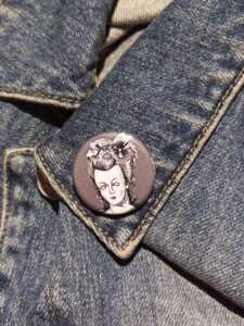 Let them eat brains! This zombie Marie Antoinette pin is perfect for spooky collectors & history lovers. Grab yours and rule the undead runway!
